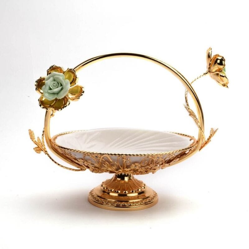 a golden basket with ceramic white bowl
