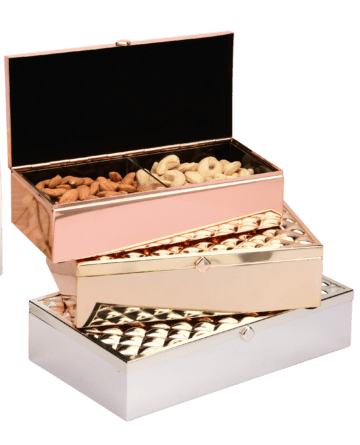 a set of three boxes in rose gold, pink, and silver colors