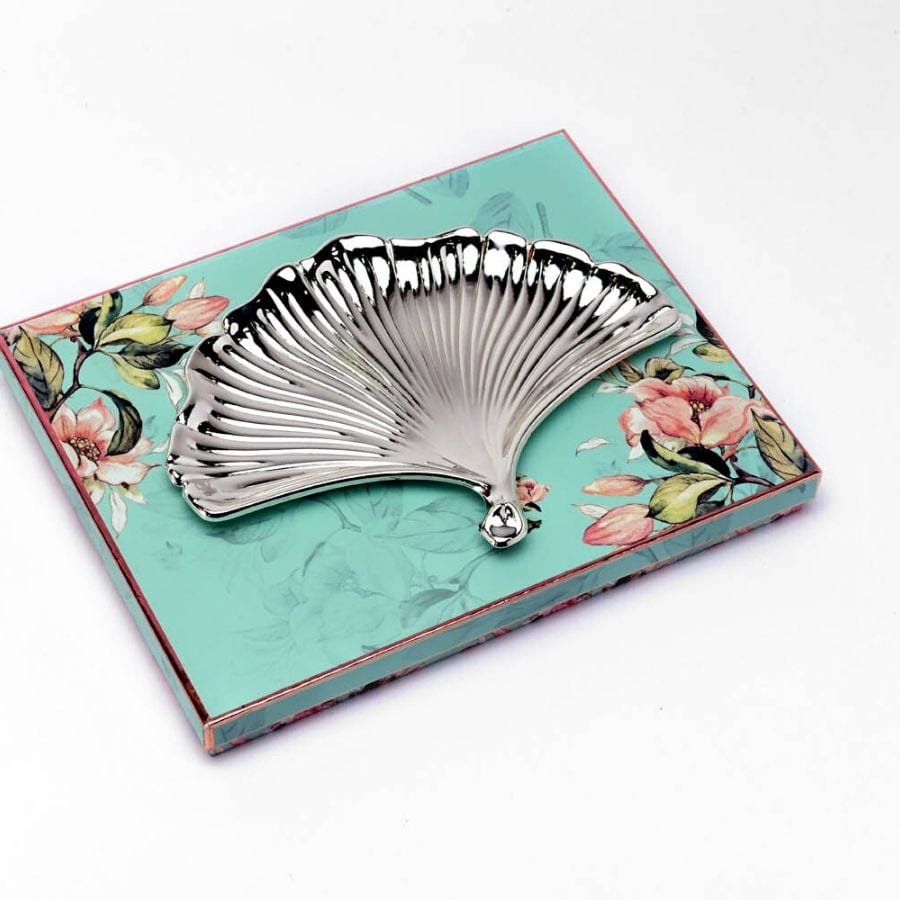 Fan Shaped Silver Platter placed on a gift box lid
