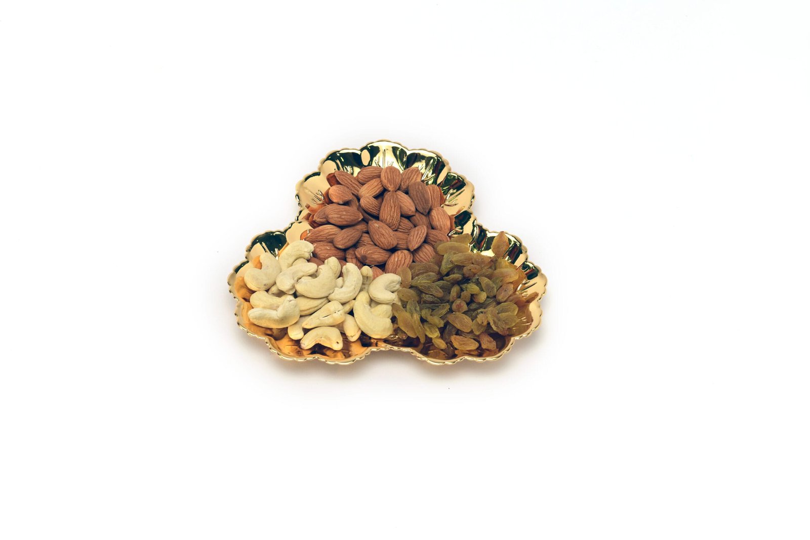 three sided silver platters with dryfruit