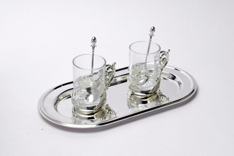 a set of two Peacock Silver Glasses With Tray