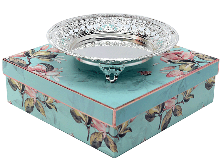 a Round shaped Silver Bowl placed on a beautiful gift box