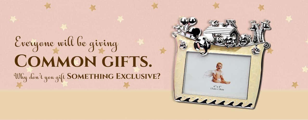 a banner with a baby themed silver photo frame and a sentence saying - everyone will be giving common gifts. why don't you gift something exclusive?