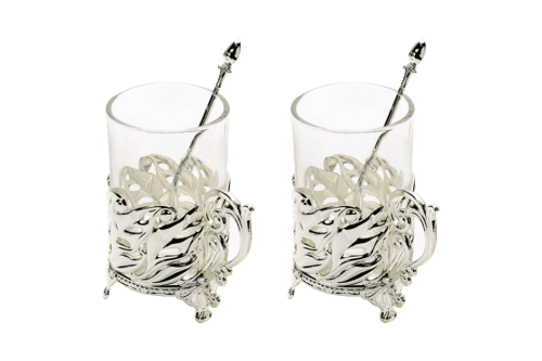 a set of two glass mugs with a silver plated base designed intricately along with spoons