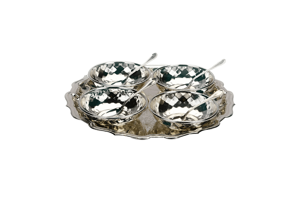 a set of four silver bowls with spoons placed on a silver tray