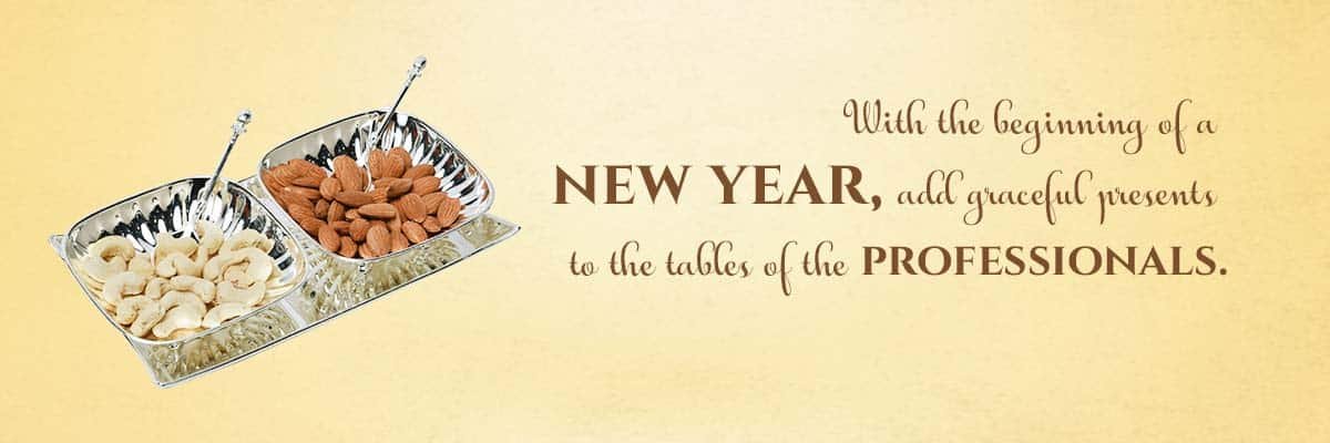 A banner with a yellow background showing a set of silver bowls, a tray and spoons & a sentence saying - with the beginning of a new year, add graceful presents to the tables of the professionals