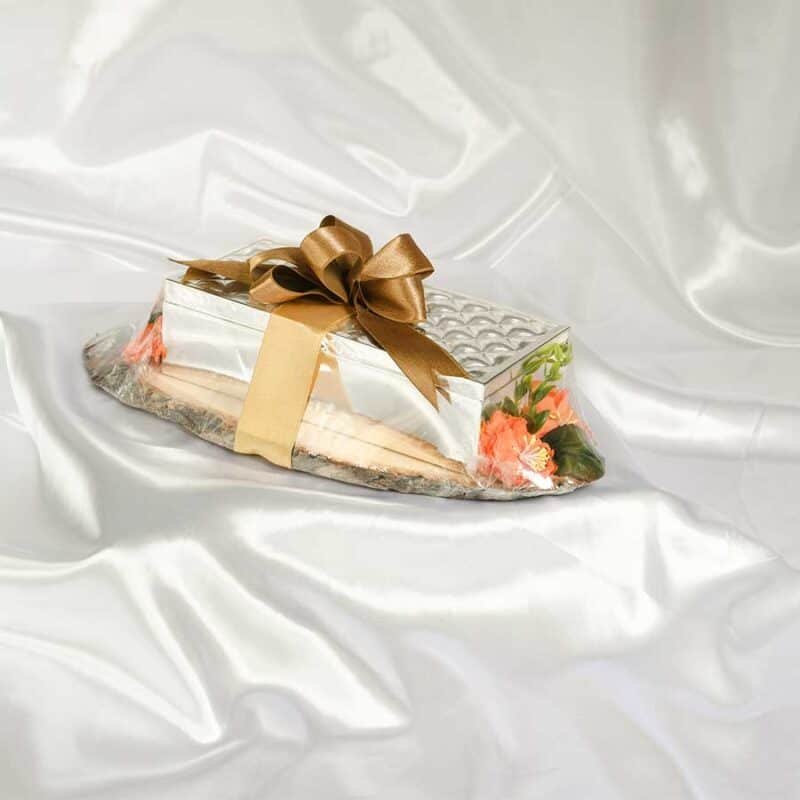 A delightful gift hamper of a silver box with knitted designs on the top