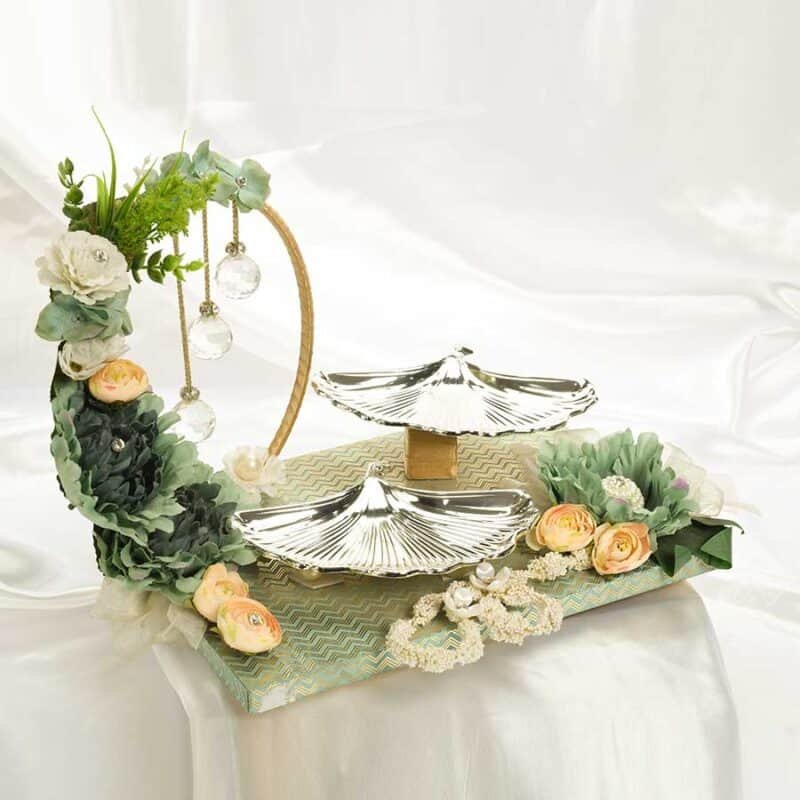 a beautiful nature themed gift hamper with silver plated shell shaped platters