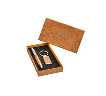 Pen and keychain accessory set in tan colored gift box.