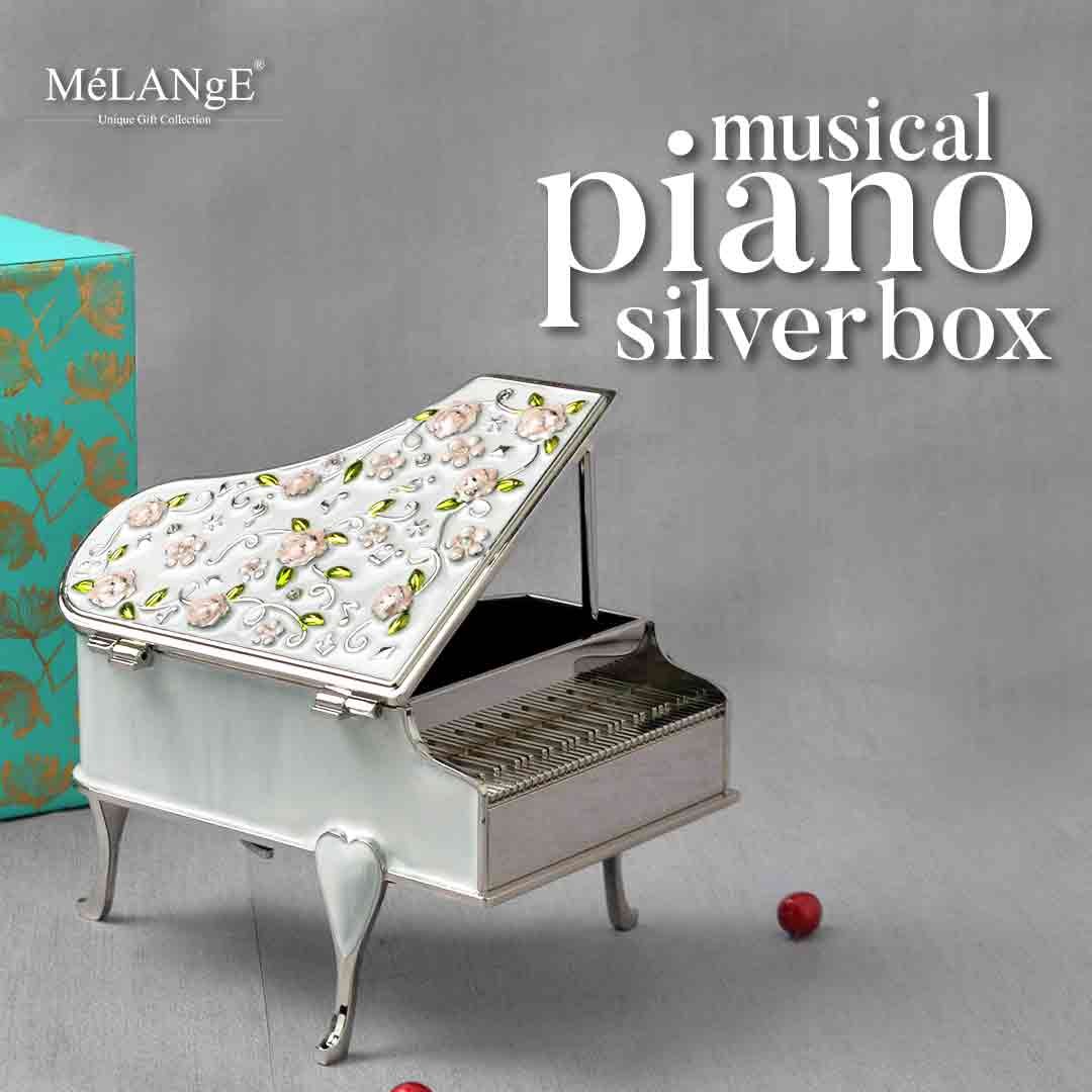 Musical Piano Silver Plated box with floral motif carved on its flap, along with a gorgeous gift box.