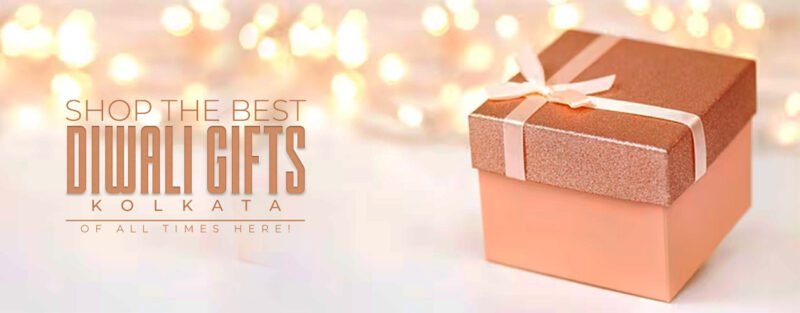 Sparkling background in front of which a beautifully wrapped gift box in peach color is kept. It says shop the best diwali gifts kolkata of all times here.